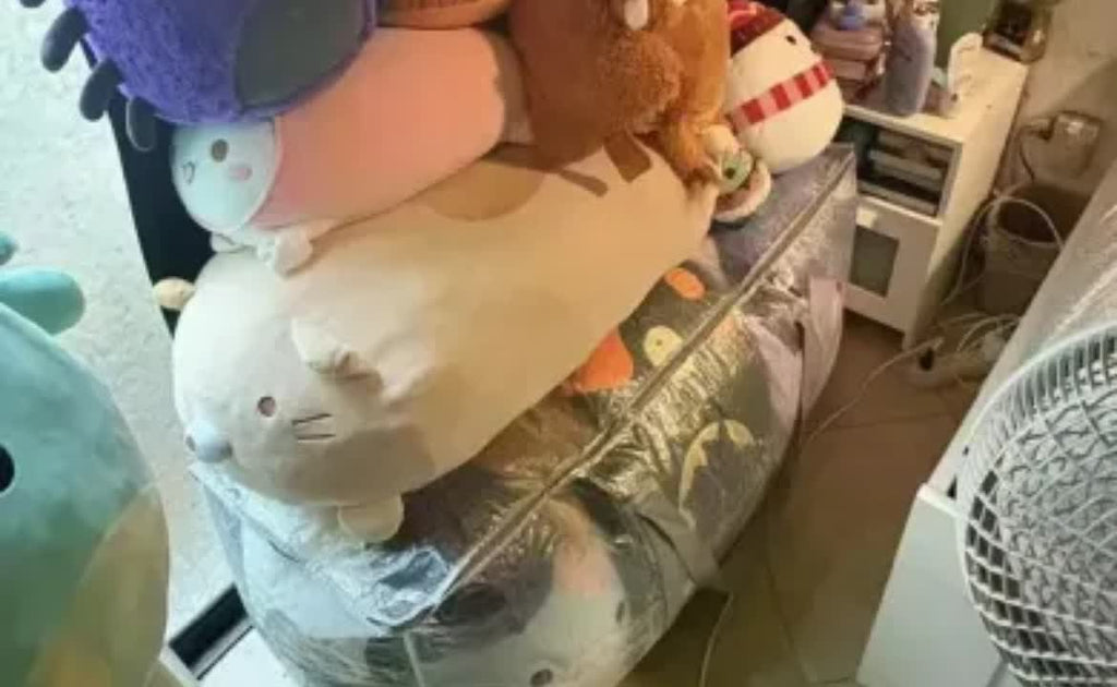 Storage bag filled with plush toys showing capacity